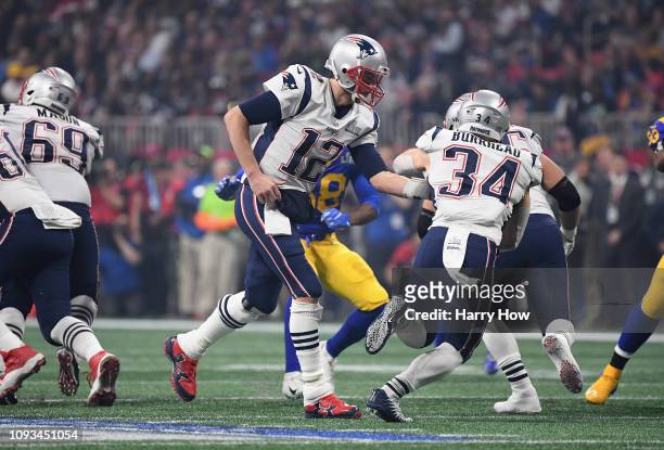 Tom Brady of the New England Patriots hands the ball of to Rex Burkhead of the New England Patriots in the second half during Super Bowl LIII at...