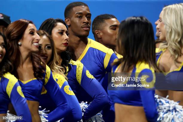 Los Angeles Rams cheerleader Quinton Peron looks on during Super Bowl LIII against the New England Patriots at Mercedes-Benz Stadium on February 3,...