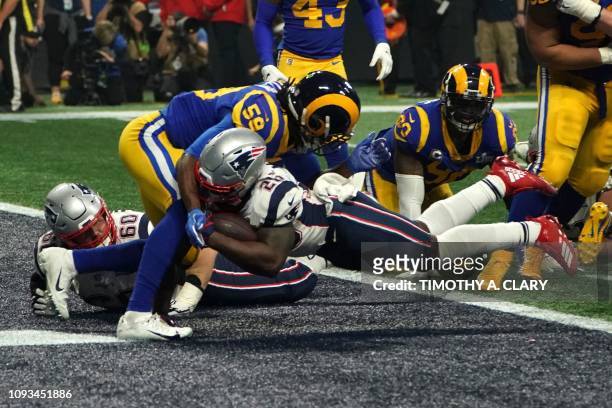 Running back for the New England Patriots Sony Michel scores a touchdown during Super Bowl LIII between the New England Patriots and the Los Angeles...