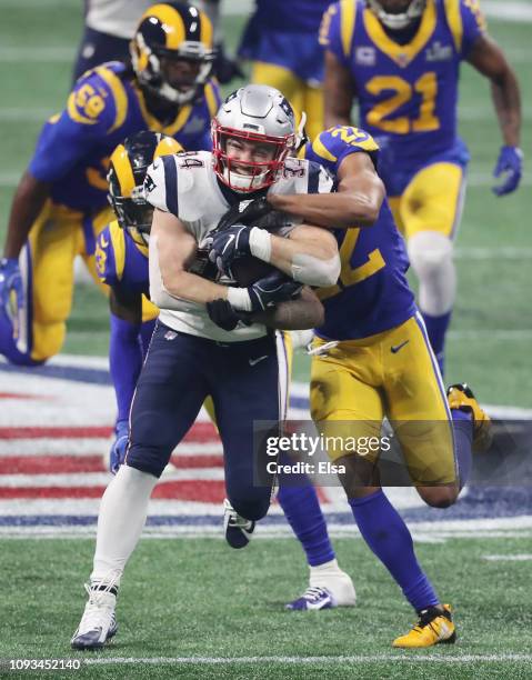 Rex Burkhead of the New England Patriots runs the ball against the Los Angeles Rams in the fourth quarter during Super Bowl LIII at Mercedes-Benz...