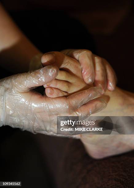 Lifestyle-culture-Asia-feet,FEATURE by Adrian AddisonThis photo taken on January 31, 2011 shows a customer getting their feet massaged at a foot...