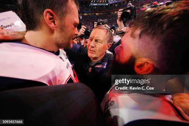 Tom Brady of the New England Patriots talks to head coach Bill Belichick of the New England Patriots after the Patriots defeat the Rams 13-3 during...