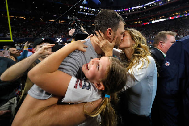 Tom Brady of the New England Patriots kisses his wife Gisele Bündchen after the Super Bowl LIII against the Los Angeles Rams at Mercedes-Benz Stadium...