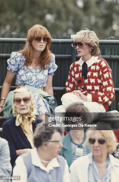 Diana, Princess of Wales with Sarah Ferguson at the Guard's Polo Club, Windsor, June 1983. The Princess is wearing a jumper with a sheep motif from...