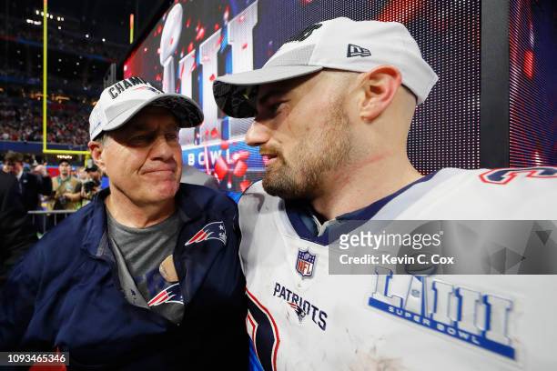Head Coach Bill Belichick of the New England Patriots celebrates with his player Rex Burkhead after winning the Super Bowl LIII against the Los...