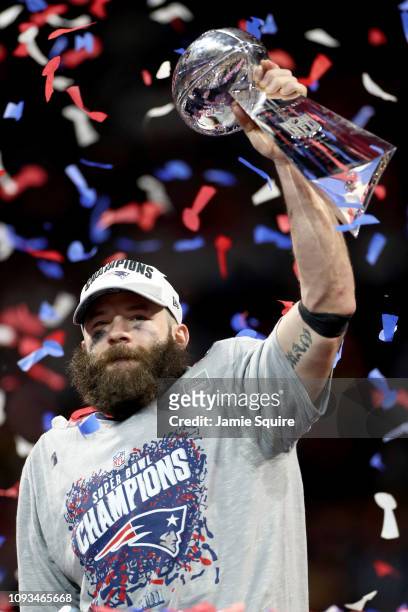 Julian Edelman of the New England Patriots raises the Vince Lombardi Trophy after the Patriots defeat the Los Angeles Rams 13-3 during Super Bowl...