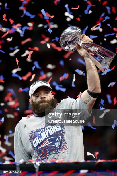 Julian Edelman of the New England Patriots raises the Vince Lombardi Trophy after the Patriots defeat the Los Angeles Rams 13-3 during Super Bowl...