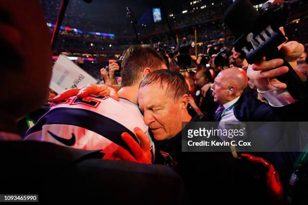 Tom Brady of the New England Patriots talks to head coach Bill Belichick of the New England Patriots after the Patriots defeat the Rams 13-3 during...
