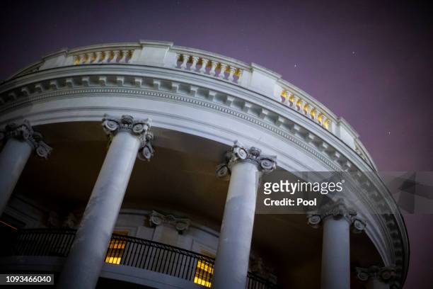 The lights on the living quarters of the White House are on ahead of the arrival by U.S. President Donald Trump at the White House February 3, 2019...