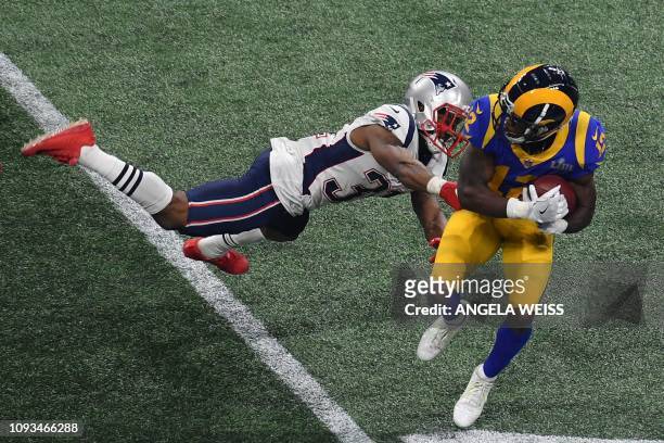 Wide receiver for the Los Angeles Rams Brandin Cooks runs past Darious Williams of the New England Patriots during Super Bowl LIII between the New...
