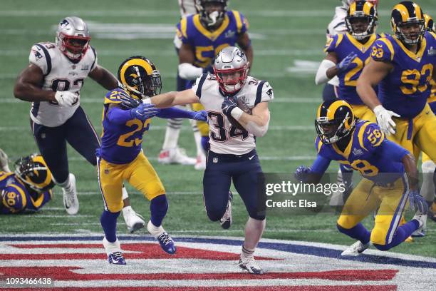 Rex Burkhead of the New England Patriots runs the ball in the second half during Super Bowl LIII against the New England Patriots at Mercedes-Benz...