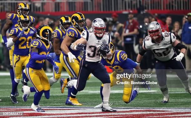 New England Patriots running back Rex Burkhead breaks loose for a long first down run after a key interception by New England Patriots cornerback...