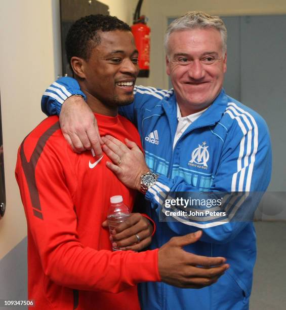 Patrice Evra of Manchester United greets Didier Deschamps of Olympique Marseille ahead of a first team training session ahead of their UEFA Champions...