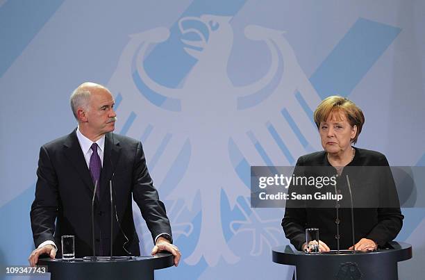 Greek Prime Minister George Papandreou and German Chancellor Angela Merkel speak to the media after talks at the Chancellery on February 22, 2001 in...