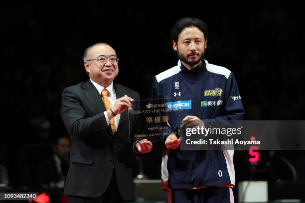 Yuta Tabuse of Tochigi Brex receives the 2nd place plate during awards ceremony following the the Basketball 94th Emperor's Cup Final between Tochigi...