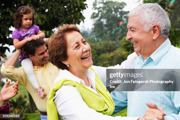 senior hispanic couple dancing outdoors - colombia dance stock pictures, royalty-free photos & images