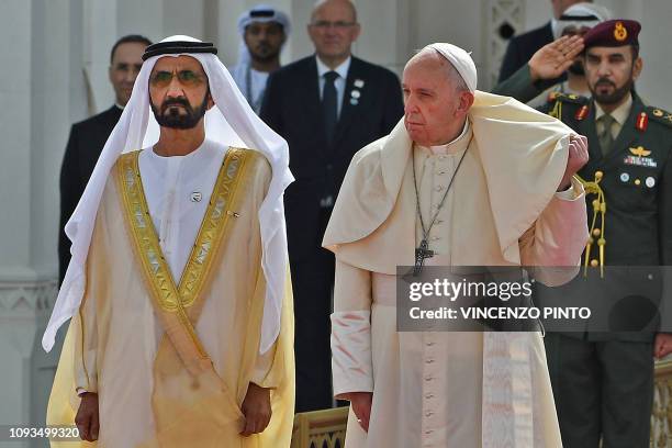 Pope Francis is welcomed by Dubai ruler Sheikh Mohammed bin Rashid Al-Maktoum and Abu Dhabi's Crown Prince Mohammed bin Zayed al-Nahyan upon his...