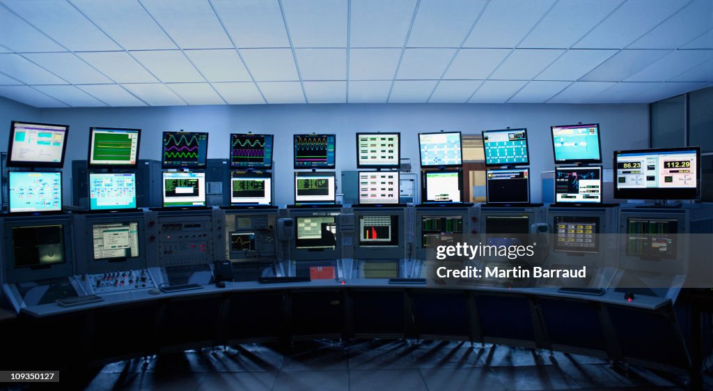 Computer screens in control room