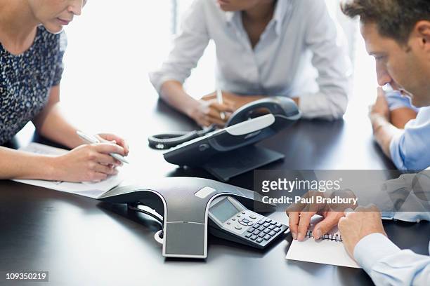 business people talking on conference call - telekommunikation stock pictures, royalty-free photos & images