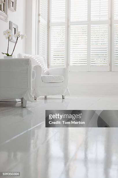 armchair in elegant white living room - low angle view home stock pictures, royalty-free photos & images