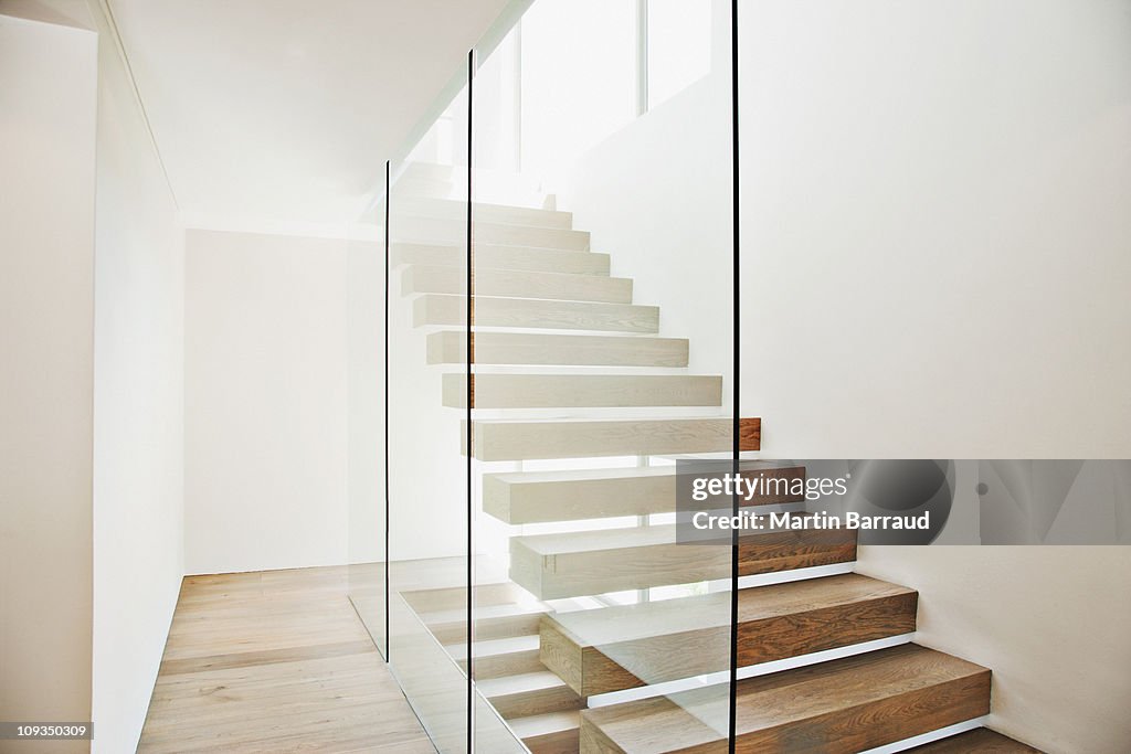 Floating staircase and glass walls in modern house