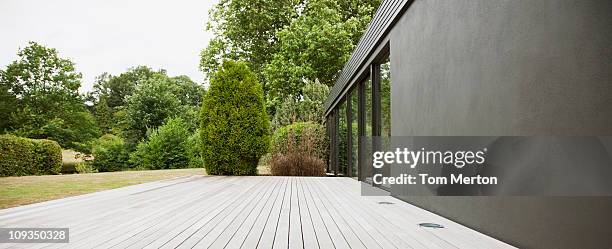 patio and backyard of modern house - garden patio stock-fotos und bilder