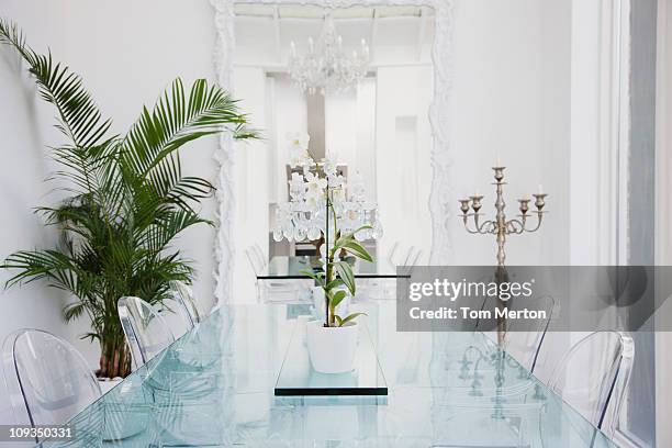 plastic chairs and table in modern dining room - transparent plastic stock pictures, royalty-free photos & images