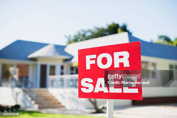 for sale sign in yard of house - for sale stock pictures, royalty-free photos & images