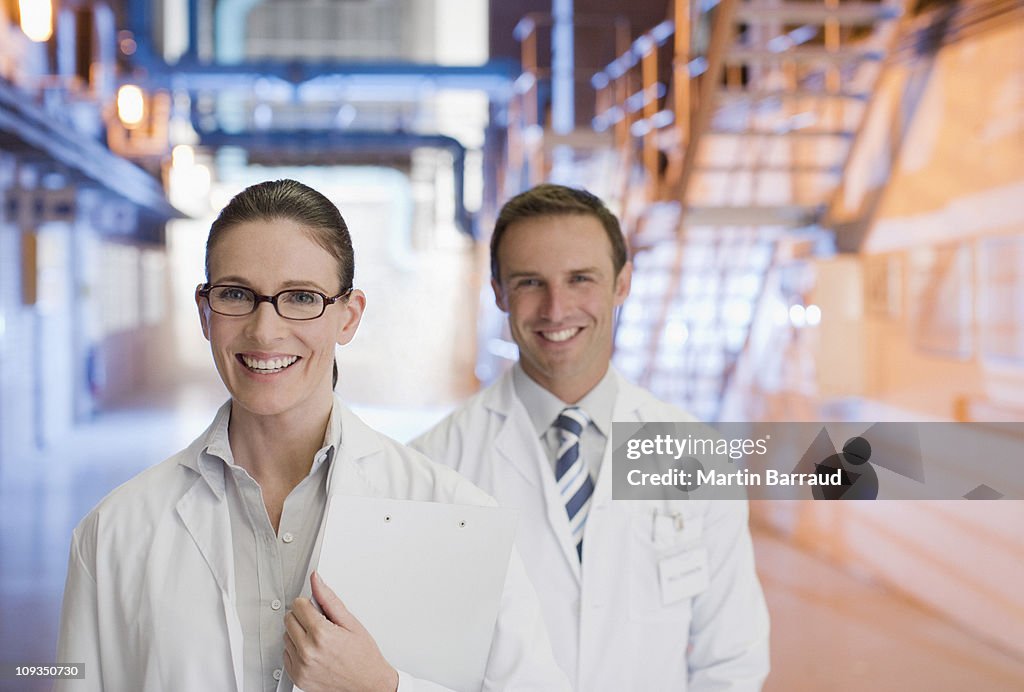 Scientists standing together in factory