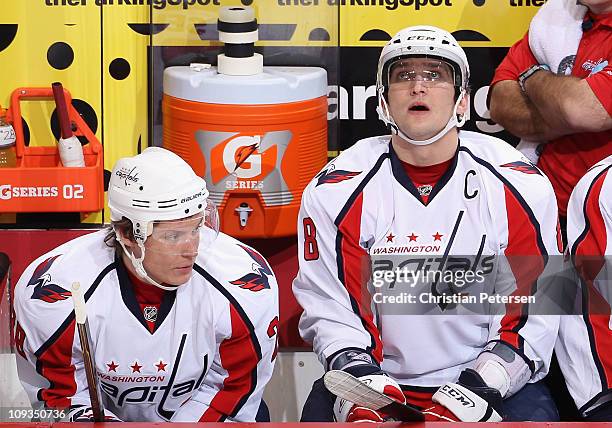 Alexander Semin and Alex Ovechkin of the Washington Capitals on the bench during the NHL game against the Phoenix Coyotes at Jobing.com Arena on...