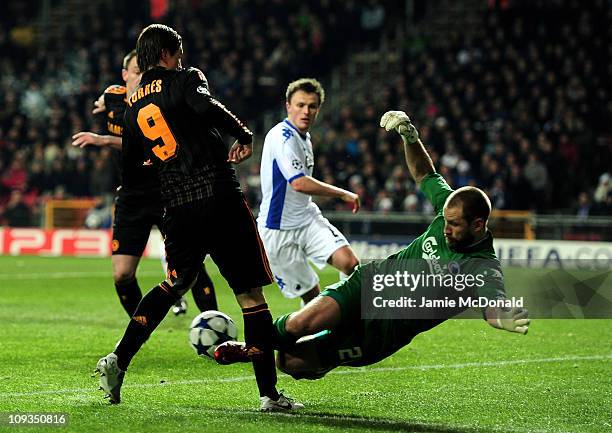 Fernando Torres of Chelsea is challenged by Johan Wiland of FC Copenhagen during the UEFA Champions League round of 16 first leg match between FC...