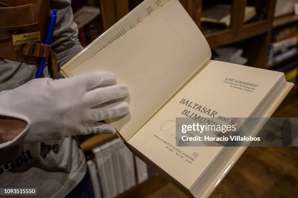 Specialist Rui Moutinho shows an autographed copy of Jose Saramago's Baltasar and Blimunda, at "Sala Gemma" in Lello Bookstore on the eve of its...