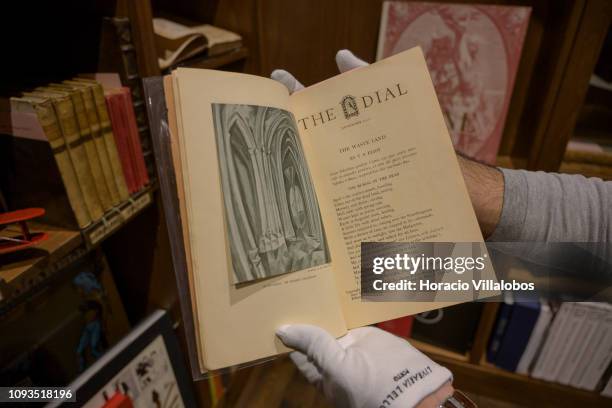 Specialist Rui Moutinho shows a copy of T.S. Eliot The Dial at "Sala Gemma" in Lello Bookstore on the eve of its 113th anniversary on January 12,...