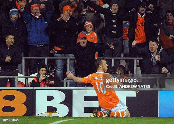 Blackpool's English forward Brett Ormerod celebrates after scoring the third goal during the English Premier League football match against Tottenham...