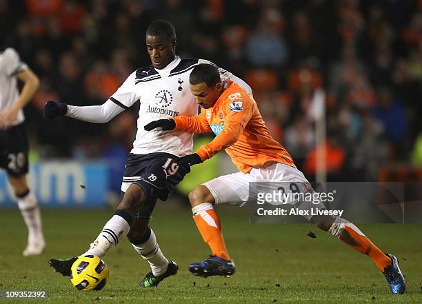 Campbell of Blackpool battles for the ball with Sebastien Bassong of Tottenham Hotspur during the Barclays Premier League match between Blackpool and...