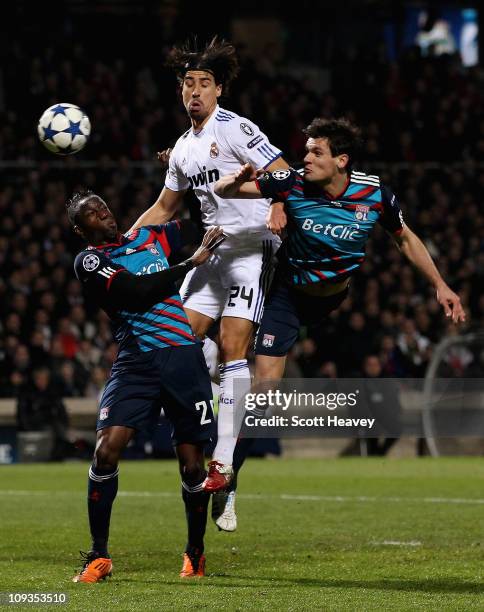 Sami Khedira Real Madrid in action with Aly Cissokho and Dejan Lovren of Lyon during the Champions League match between Lyon and Real Madrid at Stade...