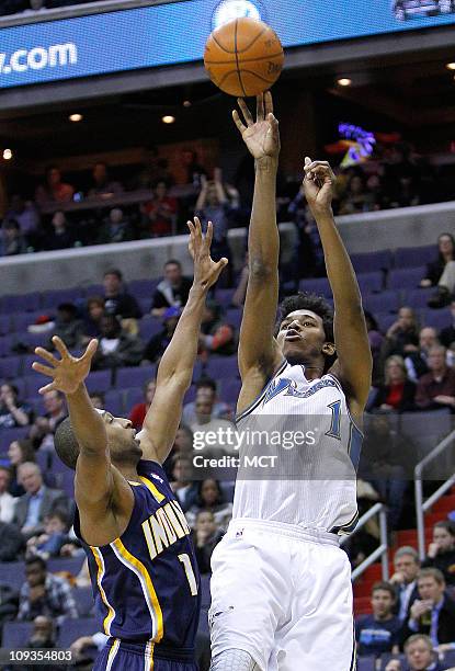 Washington Wizards shooting guard Nick Young shoots over Indiana Pacers shooting guard Dahntay Jones during their game played at the Verizon Center...