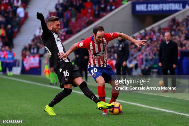 Juanfran of Atletico Madrid battles for possession with Ruben Rochina of Levante during the La Liga match between Club Atletico de Madrid and Levante...