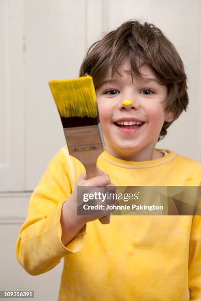 yellow paint - boy yellow shirt stock pictures, royalty-free photos & images