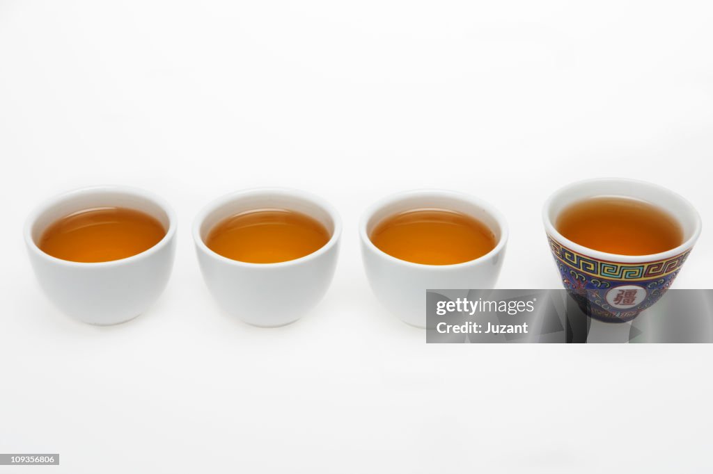 Chinese tea cups full of tea