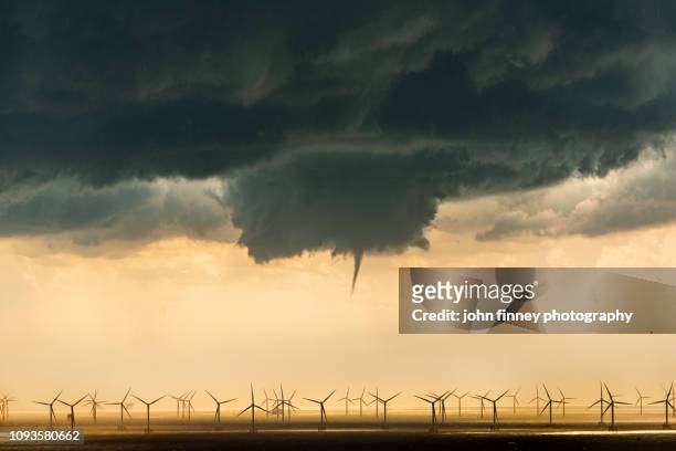 a tornado funnel cloud over a wind farm. uk. - extreme weather stock pictures, royalty-free photos & images