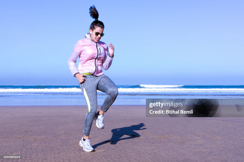 Young woman warming up for sports