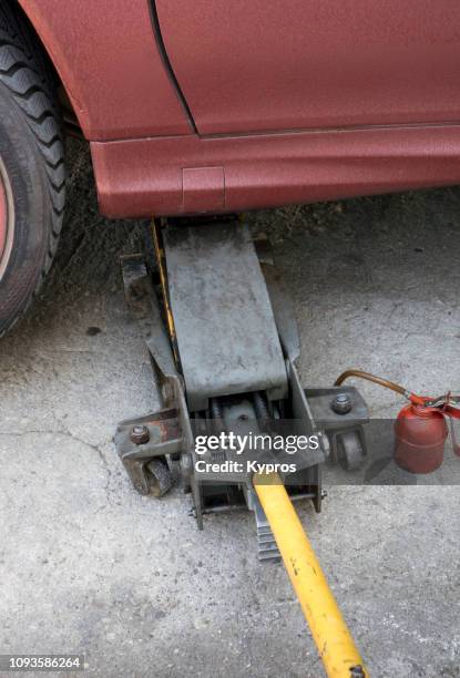 europe, italy, 2018: view of jacking sports car with hydraulic jack - jack stock pictures, royalty-free photos & images