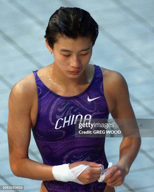 Chinese diver Li Na looks dejected after the 10m platform final 24 September 2000 at Sydney international Aquatic centre hosting the diving...