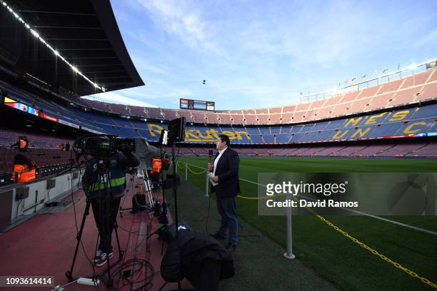 Journalist works next to the pitch prior to the La Liga match between FC Barcelona and SD Eibar at Camp Nou on January 13, 2019 in Barcelona, Spain.