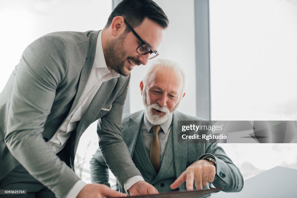 Work associates revising paperwork