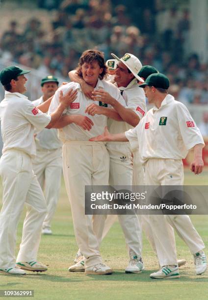 South African bowler Brian McMillan is congratalued by Hansie Cronje during the 1st Test match between England and South Africa at Lord's cricket...