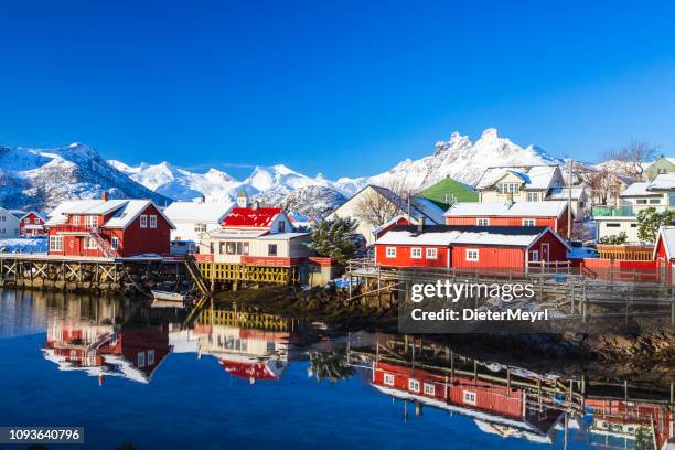 houses in the lofoten islands bay. natural landscape during sunrise - reine stock pictures, royalty-free photos & images