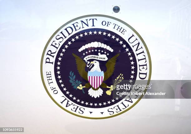 The seal of the President of the United States is painted on the side of the Lockheed JetStar jet plane which flew Lyndon B. Johnson and his family...