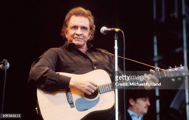 Johnny Cash performs on stage at Glastonbury Festival, June 1994.